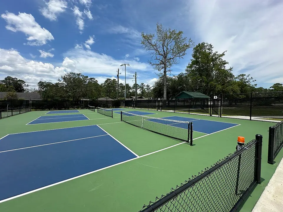 Generic photo of outdoor pickleball courts; not a Picklr club.