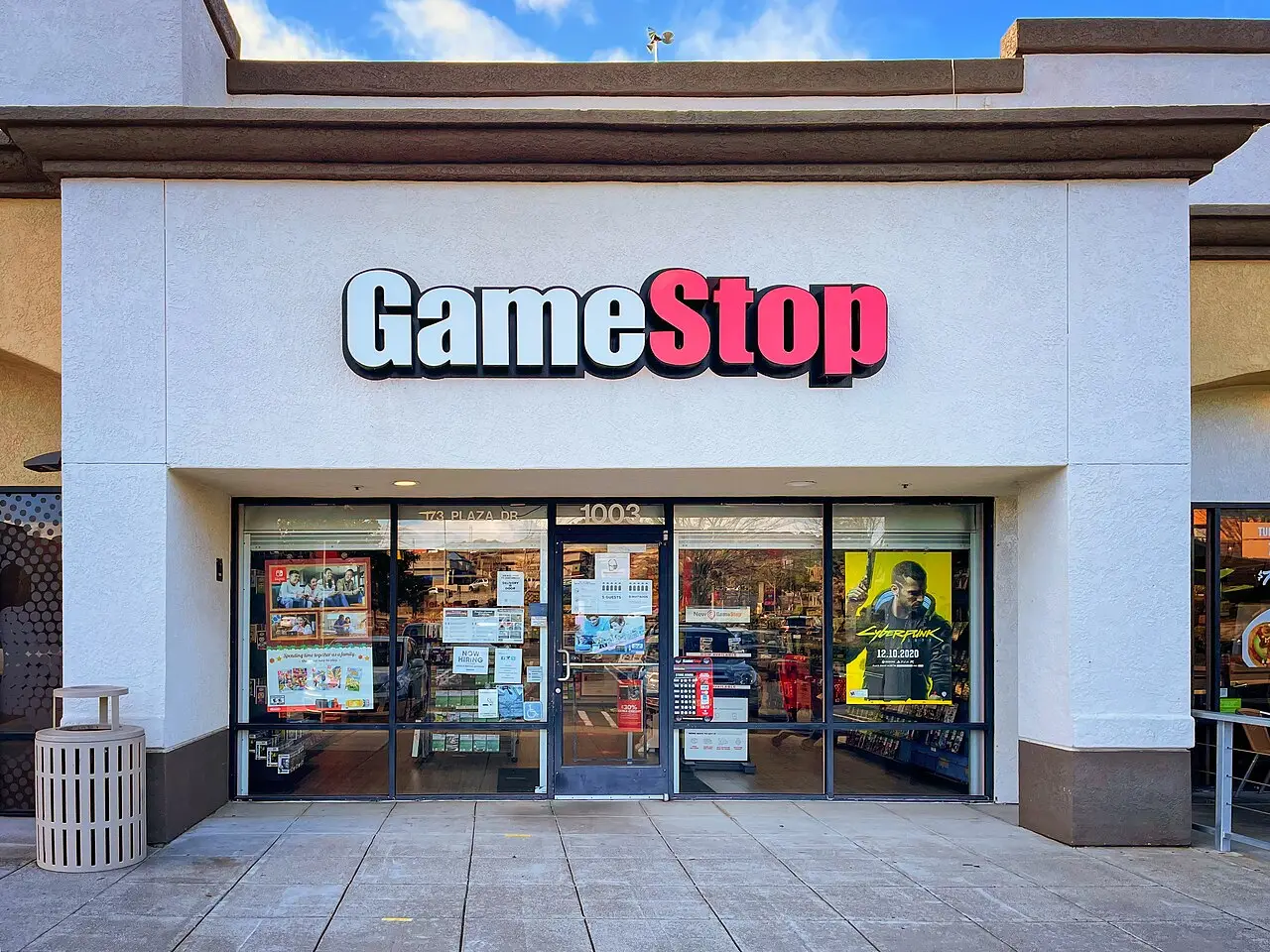 Exterior of a GameStop retail store with the red and white storefront sign above glass doors, Vallejo, California