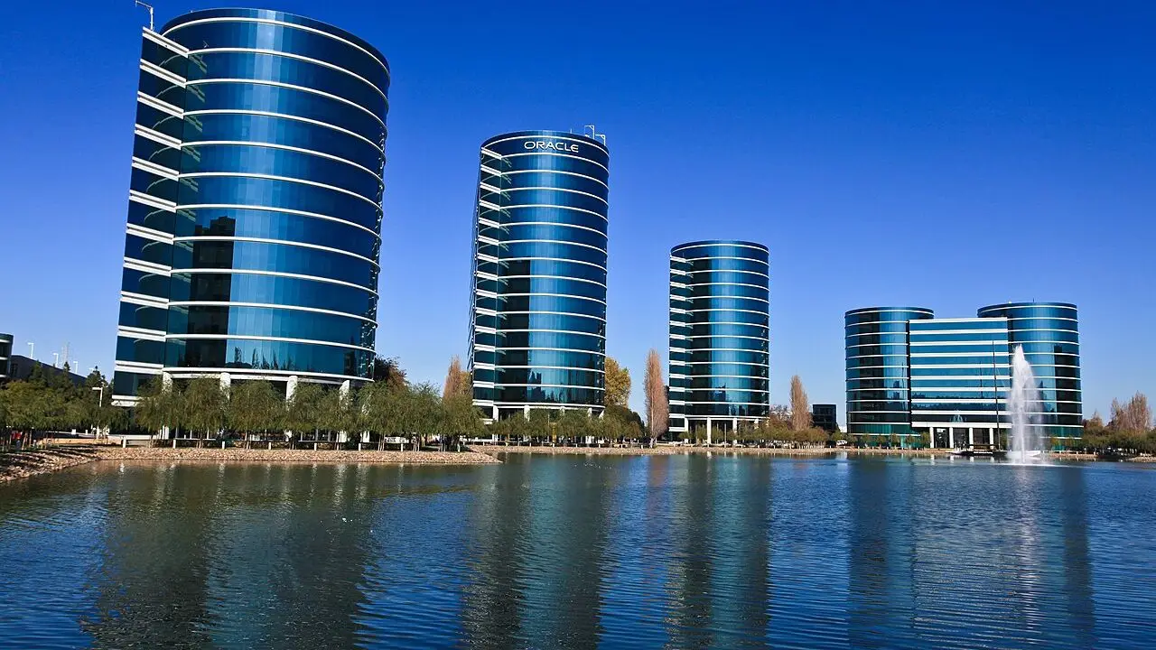 Oracle's glass office towers stand beside a lake at the Redwood Shores campus.