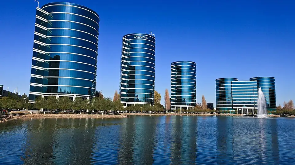 Oracle's glass office towers stand beside a lake at the Redwood Shores campus.